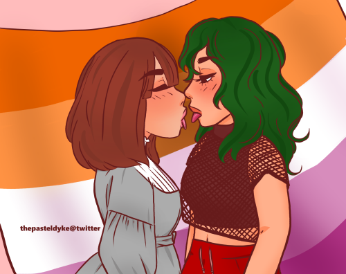 Tokage and Komori from the hip up, side view. They're standing very close to each other, sticking their tongues out. Their arms are down. Komori is wearing a grey lolita dress, Tokage is wearing a fishnet t-shirt over a black sleeveless turtleneck croptop and red sweatpants. Thebackground is the lesbian sunset flag.