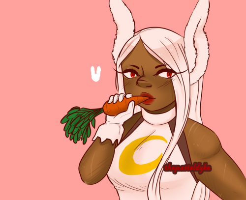 Miruko from the bust up, holding a carrot in her right cand, nibbling on the end of it. She's wearing her hero costume. The background is a solid light reddish-pink with a small bunny head shape next to her face.