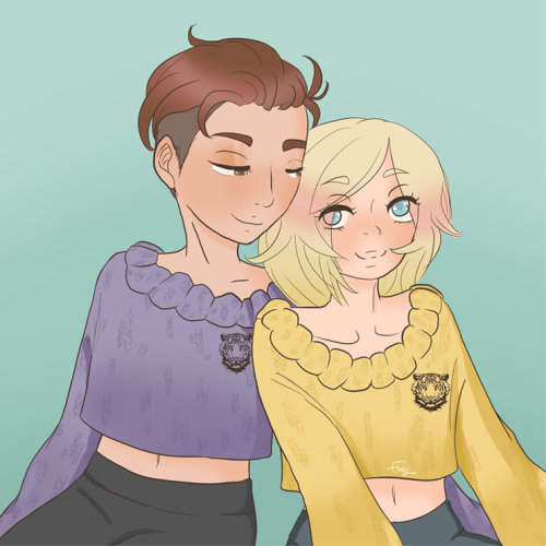 Otabek and Yuri from Yuuri on Ice, sitting next to each other, one of Otabek's arms behind Yuri. They're wearing matching knitted cropped sweaters with the face of a tiger on the left side of the chest. Otabek's sweater is purple, Yuri's is yellow. They're looking at each other, smiling.