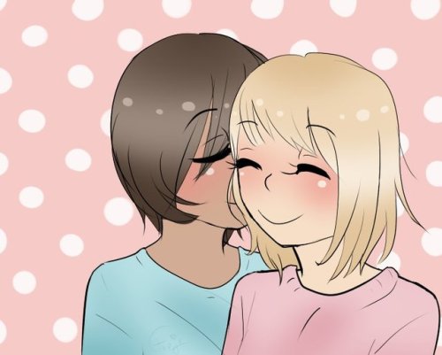 Kase and Yamada from Asagao to Kase-san. Kase is kissing Yamada on the cheek, both with their eyes closed. Yamada is wearing a pink shirt, Kase a blue one.