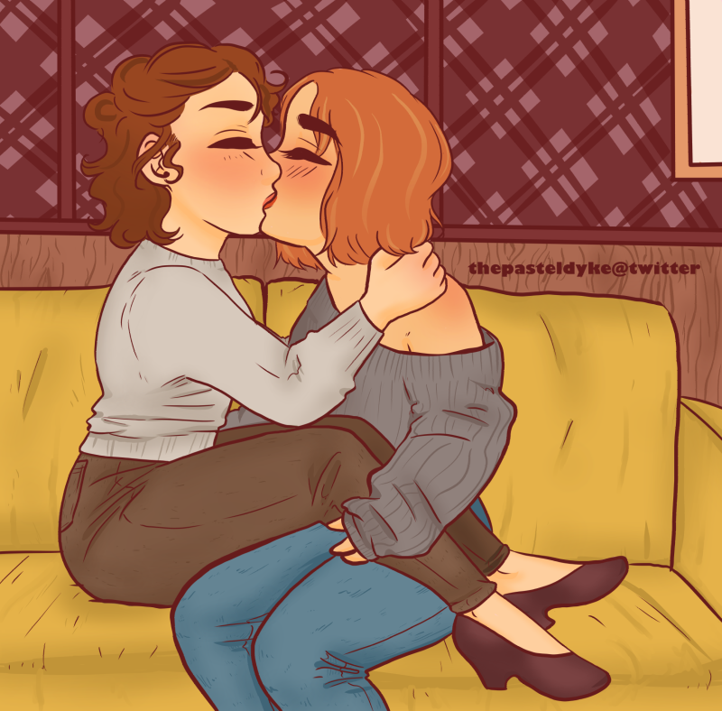 Nancy and Robin from Stranger Things, kissing. Nancy has her legs on Robin's lap, Robin holding on to her calf with one hand. Nancy has her arms around Robin's shoudlers. They're sitting on a yelolow couch, Nancy wearing a light grey shirt and Robin in a darker grey sweater that's falling off her shoulder. Nancy is wearing dark slacks while Robin is wearing jeans.