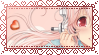 Stamp of half of Super Sonico's face, a heart next to her, hand by her face